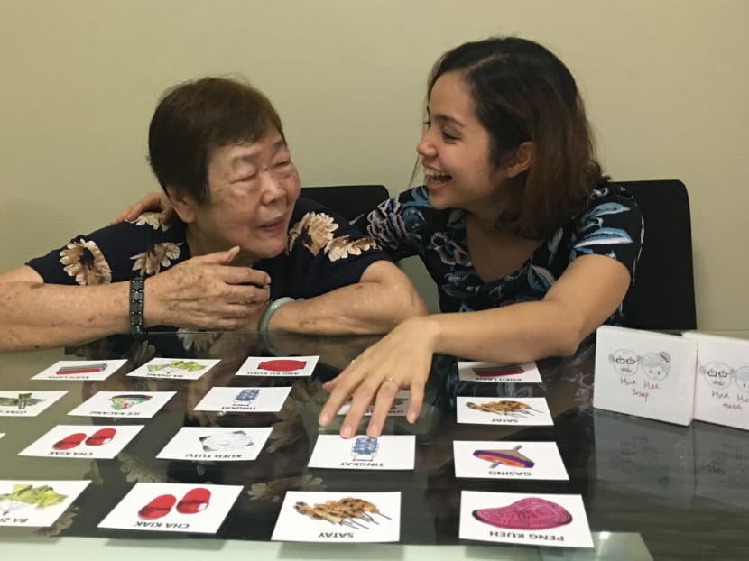 Hua Hee creator Christel Goh (right), 26, seen playing the card game with her 80-year-old maternal grandmother Lily Teo. Photo: Playhuahee/Facebook via Christel Goh