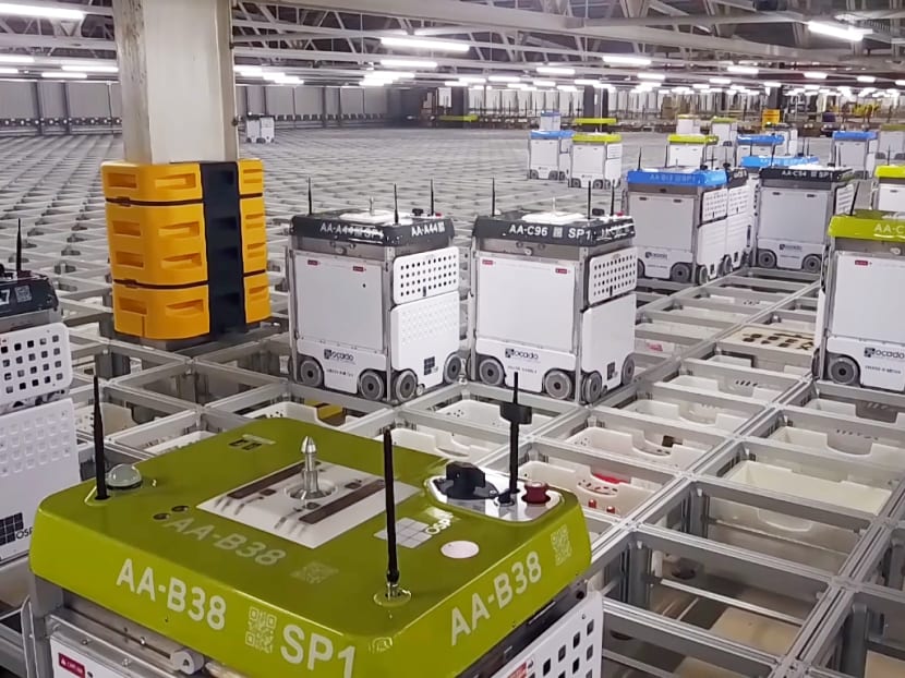 Ocado Smart Platform robots at Andover CFC. The company is Britain’s largest online grocer and the robots are the latest addition to its automation arsenal. Photo: Ocado Technology/YouTube screen capture