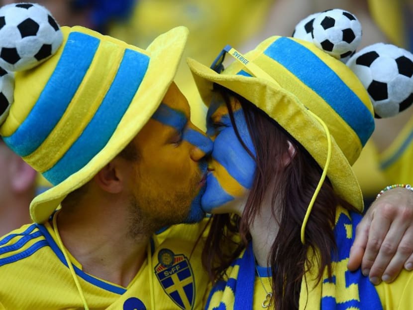 Sweden fans kiss at EURO 2016. AFP file photo
