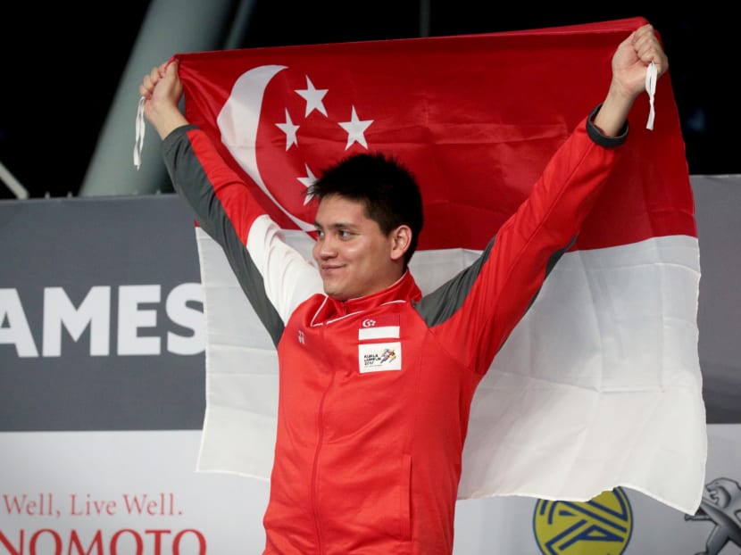 Joseph Schooling receives his gold medal for the SEA Games mens 100m buterfly on 23 August 2017. Photo: Jason Quah/TODAY