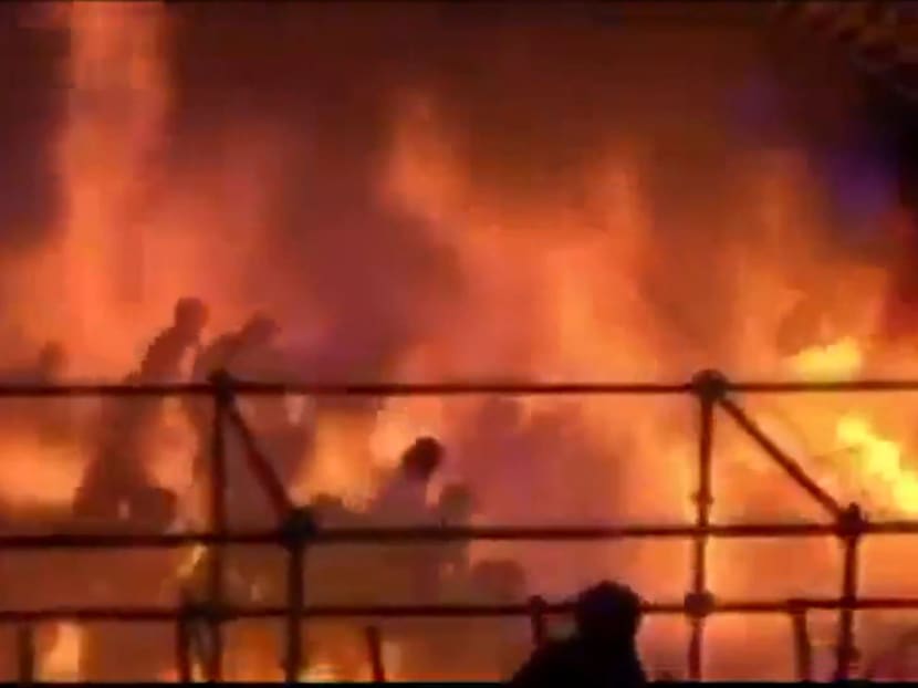This frame grab from video footage provided by Apple Daily from reader Miss Huang shows revelers being engulfed by flames at the Formosa Fun Coast water park in Pali district, in New Taipei City, on June 27, 2015.