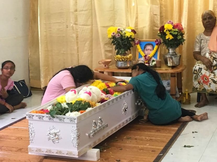M. Vasanthapiriya's cousin and elder sister watching over her casket at her wake in their house in Nibong Tebal, Penang. Photo: The Malaysian Insight