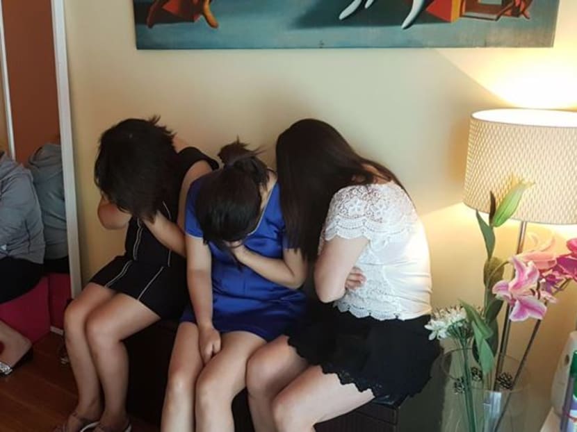 The women are being investigated by the Police for their suspected involvement in vice-related activities in unlicensed massage establishments. Photo: Singapore Police Force