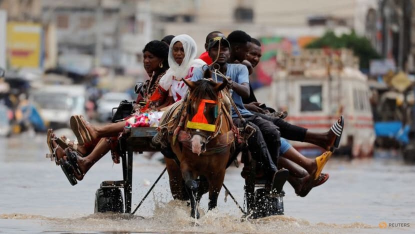 Senegal capital wades through floodwater after heavy rain Senegal capital wades through floodwater after heavy rain