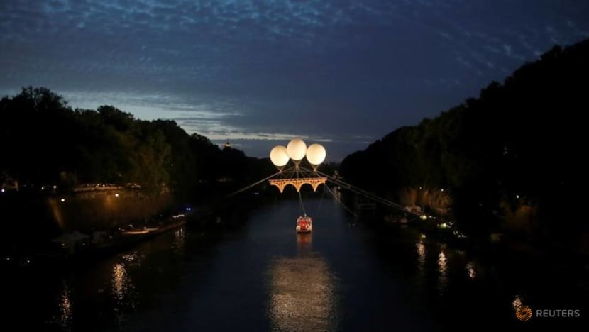 Michelangelo-inspired cardboard bridge floats above Rome's Tiber river Michelangelo-inspired cardboard bridge floats above Rome's Tiber river