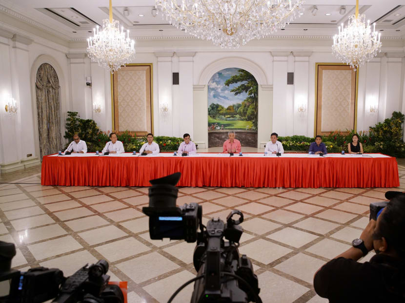 Prime Minister Lee Hsien Loong (fourth from right) and political officeholders during a press briefing to unveil the latest Cabinet on July 25, 2020.