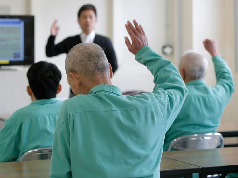 Inmates listen to a lecture by Takeshi Izumaru, director at the Nagasaki Community Support Center at Sasebo Prison in Sasebo, Nagasaki Prefecture, Japan. Photo: Bloomberg