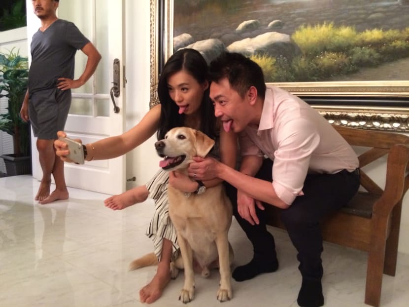 Human stars Rebecca Lim and Tay Ping Hui get a wefie moment with canine celeb Flapper.