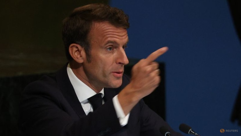 Taking swipe at Russia, Macron says fence sitters need to wake up