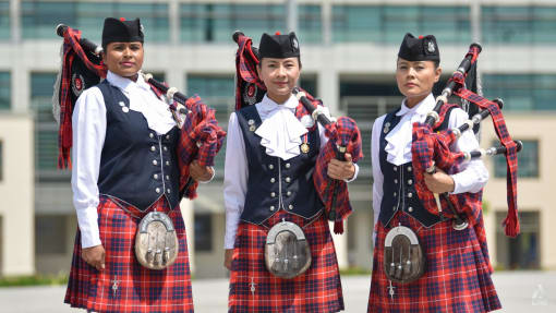 These members of the all-female Singapore police band can sing, dance and play the bagpipes