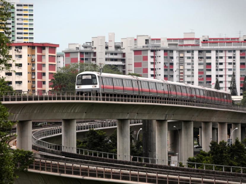 A north south line MRT train heads towards Bishan station.