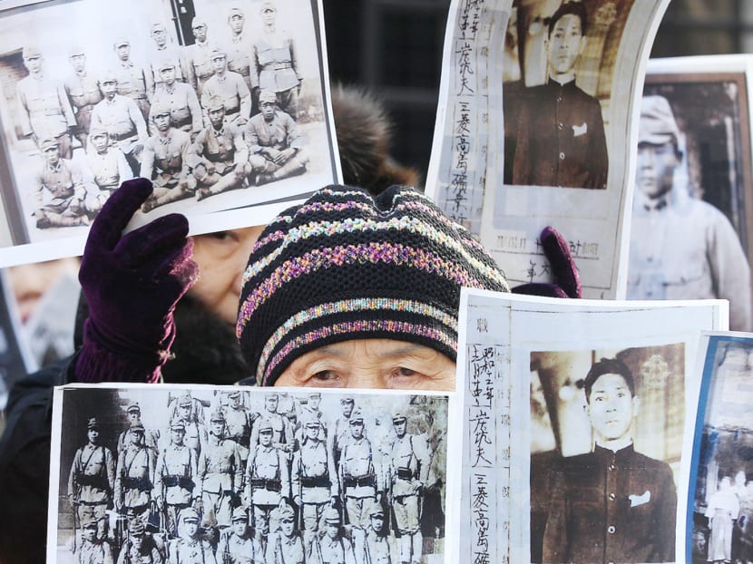 South Korean family members of World War II victims at a rally at the Foreign Ministry in Seoul yesterday. Photo: AP