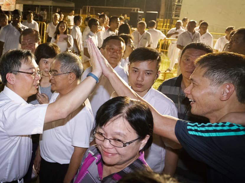 Mr Gan Kim Yong (left), who leads the PAP team at Chua Chu Kang GRC, meeting supporters after yesterday’s rally at Chua Chu Kang Secondary School. Photo: Ray Chua