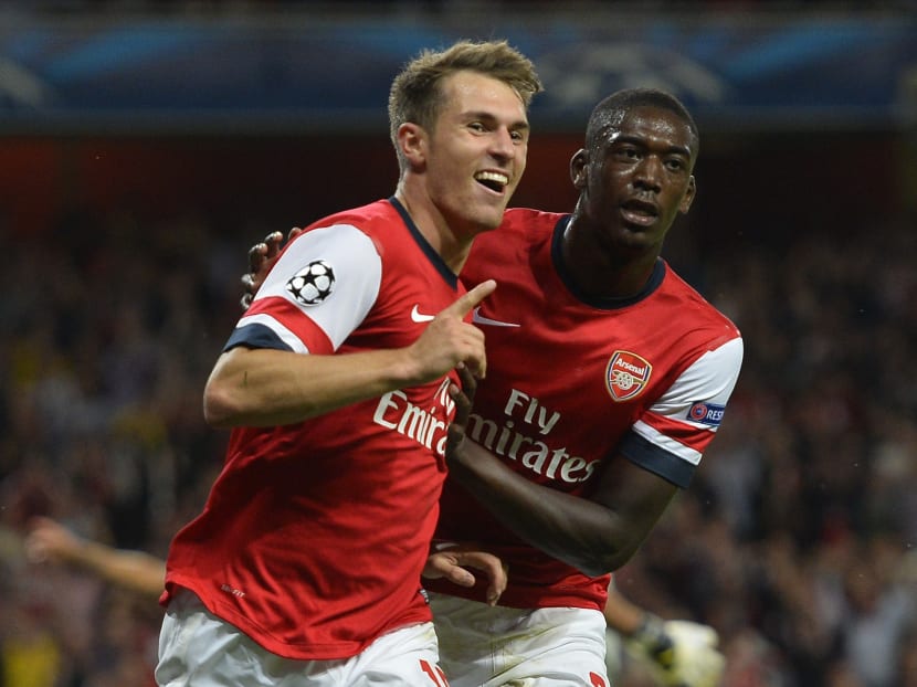 Arsenal's Aaron Ramsey celebrates his goal against Fenerbahce with team-mate Yaya Sanogo during their Champions League match at the Emirates Stadium in London on Aug 27, 2013. Photo: Reuters