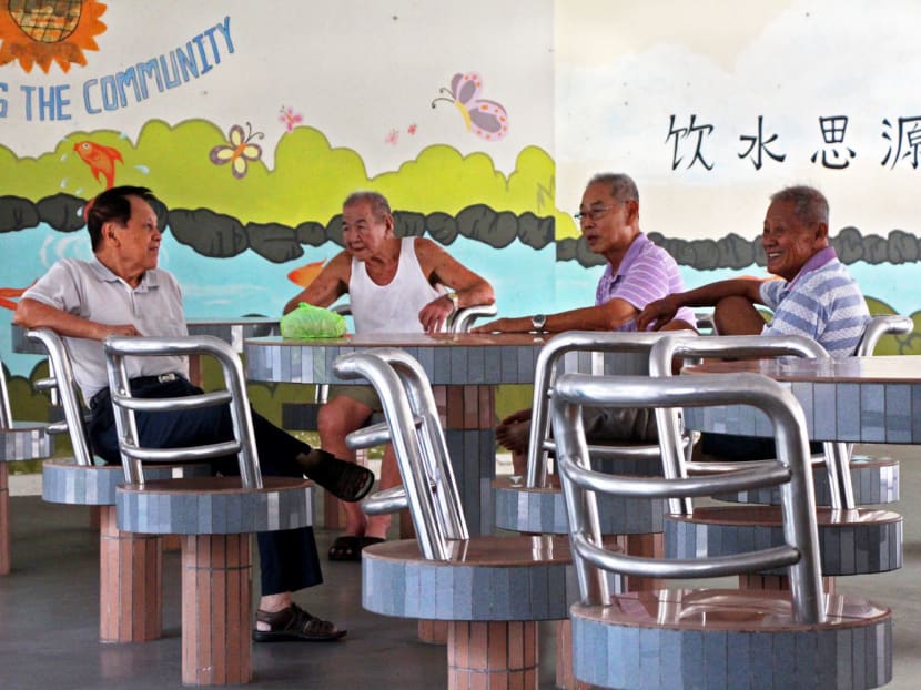 Elderly residents at the void deck of an HDB block in Ang Mo Kio. Whether retirees are living in HDB flats or private property should not matter as much as whether they are still earning an income. TODAY file photo