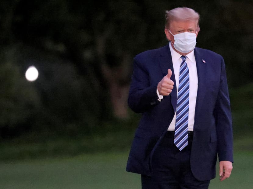 US President Donald Trump after leaving the Walter Reed medical centre, where he was treated for Covid-19, on Oct 5, 2020. US President Donald Trump after leaving the Walter Reed medical centre, where he was treated for Covid-19, on Oct 5, 2020.