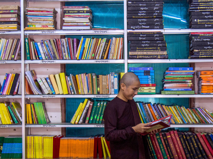 This photo taken on Aug 26, 2020 shows Myanmar Buddhist nun Ketumala reading a book in the library of a monastery in Yangon. In a society that urges every woman to "regard her son as her master and her husband as her god", Buddhist nun Ketumala is already an outlier.