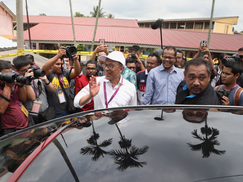 Mr Anwar Ibrahim waving to the media after visiting a polling station during the Port Dickson by-election in October 2018. Mr Anwar Ibrahim waving to the media after visiting a polling station during the Port Dickson by-election in October 2018.