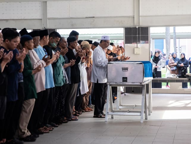 Mourners attend the burial ceremony of Afifah Munirah Muhammad Azril on Tuesday (April 23). She was one of the two victims who died in the Tampines accident on April 22, 2024. 