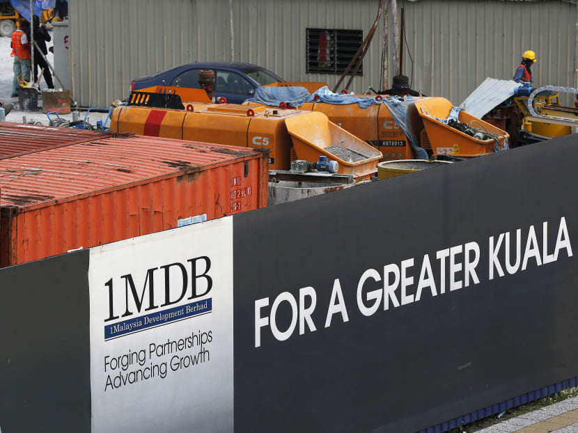 Workmen are pictured on site at the 1Malaysia Development Berhad (1MDB) flagship Tun Razak Exchange development in Kuala Lumpur, Malaysia, on March 1, 2015. Photo: Reuters