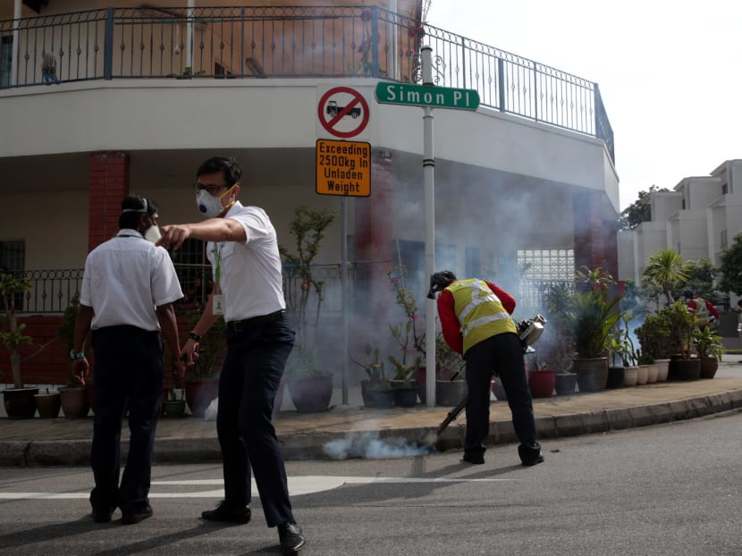 NEA officers are seen at Simon Place as the surrounding area undergoes fogging. Photo: Jason Quah/TODAY