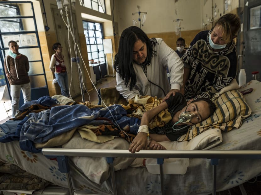 A doctor in Venezuela checking on a tuberculosis patient at a hospital in Caracas. Photo: New York Times