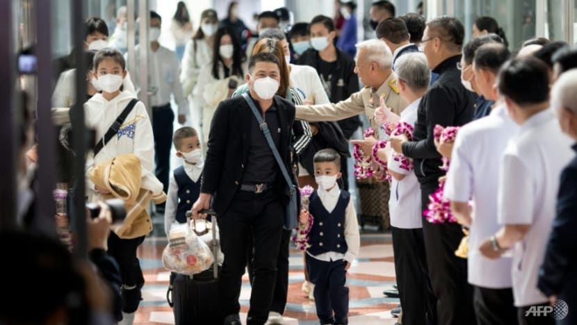 Flowers and face masks as Chinese tourists return to Thailand Flowers and face masks as Chinese tourists return to Thailand