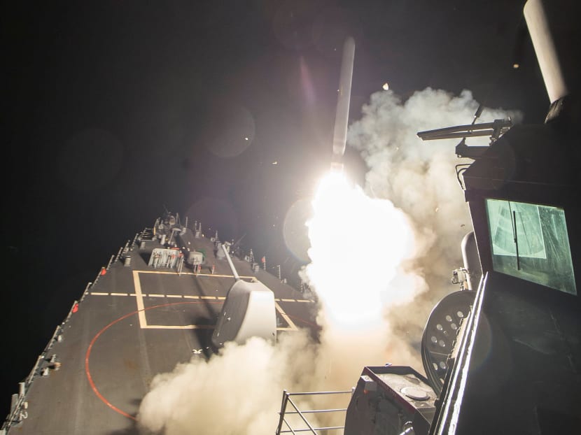 US Navy guided-missile destroyer USS Ross (DDG 71) fires a tomahawk land attack missile in Mediterranean Sea which Defense Department said was a part of cruise missile strike against Syria on April 7, 2017. Photo: Reuters