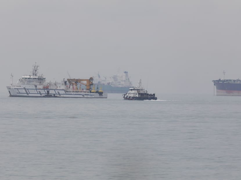 A Singapore Police Coast Guard vessel and a Malaysian vessel in a confrontation at the south of Tuas View Extension in 2018.
