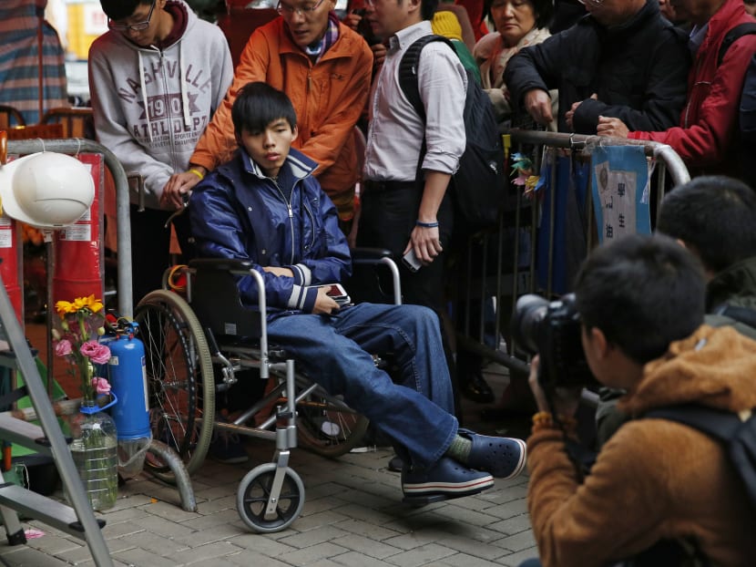 Student leader Joshua Wong on a wheel chair during his fourth day of the hunger strike. Photo: AP