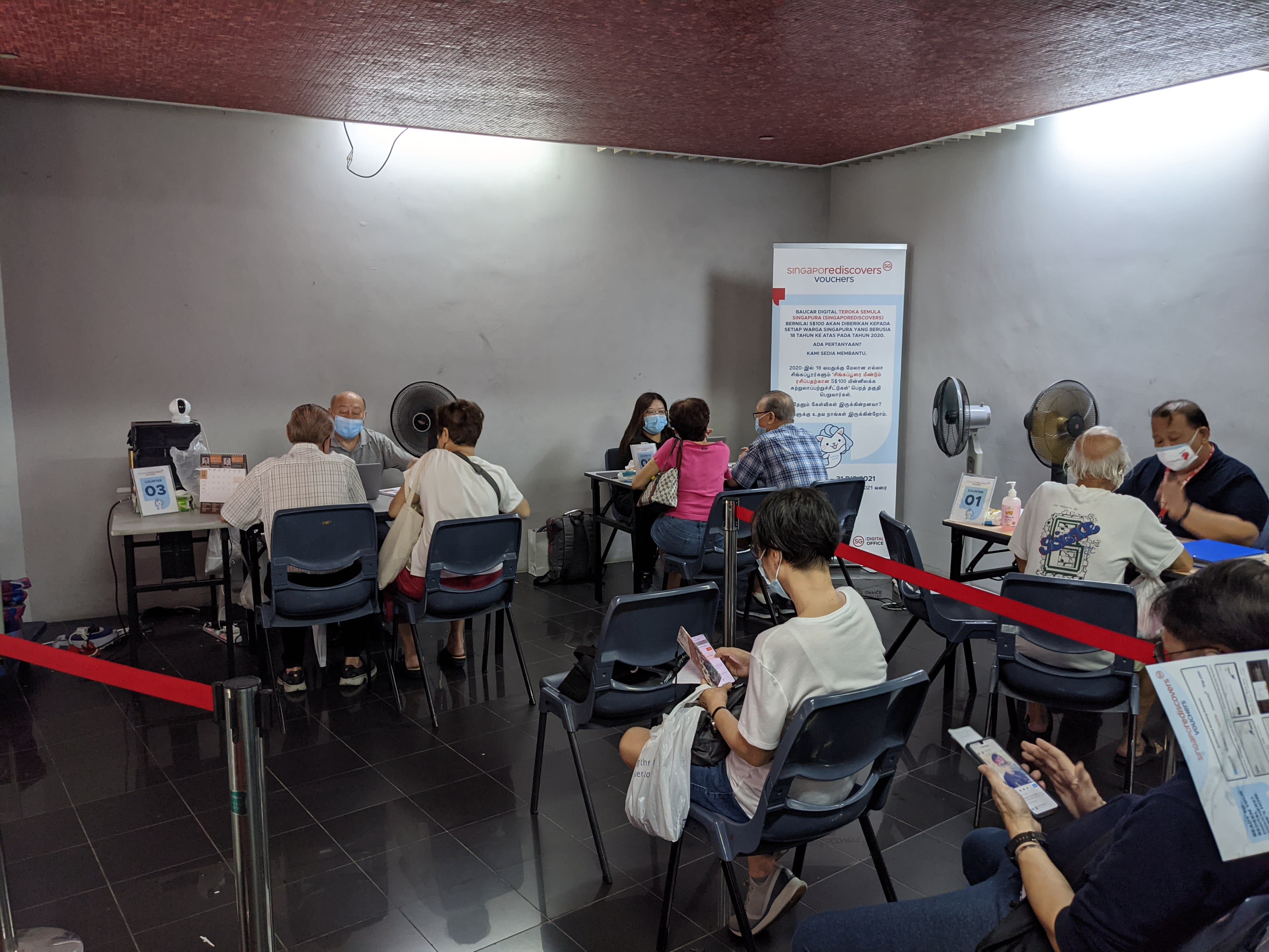 Nearly 30 people were seen waiting to redeem their SingapoRediscovers Vouchers at the Marine Parade Community Club at about 1.30pm on Dec 31, 2021. Nearly 30 people were seen waiting to redeem their SingapoRediscovers Vouchers at the Marine Parade Community Club at about 1.30pm on Dec 31, 2021.