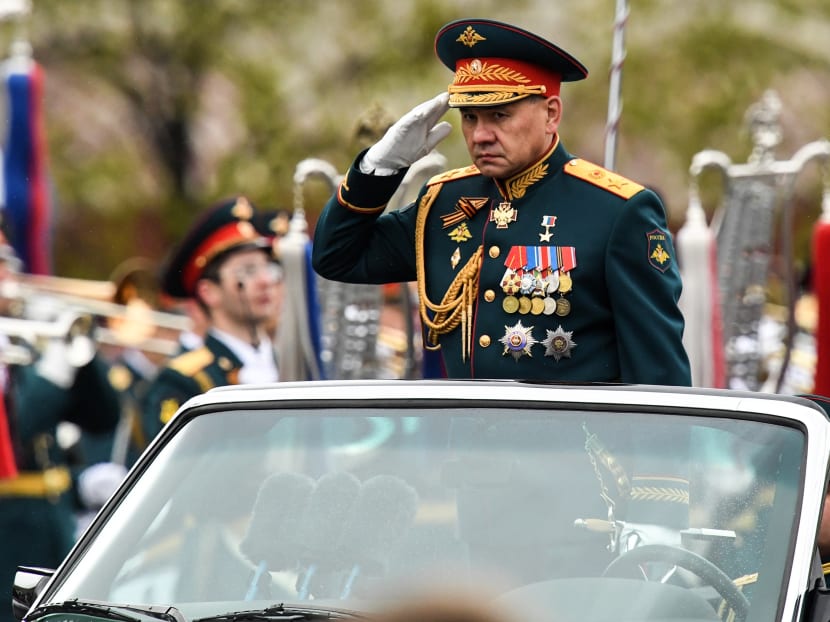 Russian Defence Minister Sergei Shoigu salutes as he reviews units during the Victory Day military parade at Red Square in Moscow. Photo: AFP