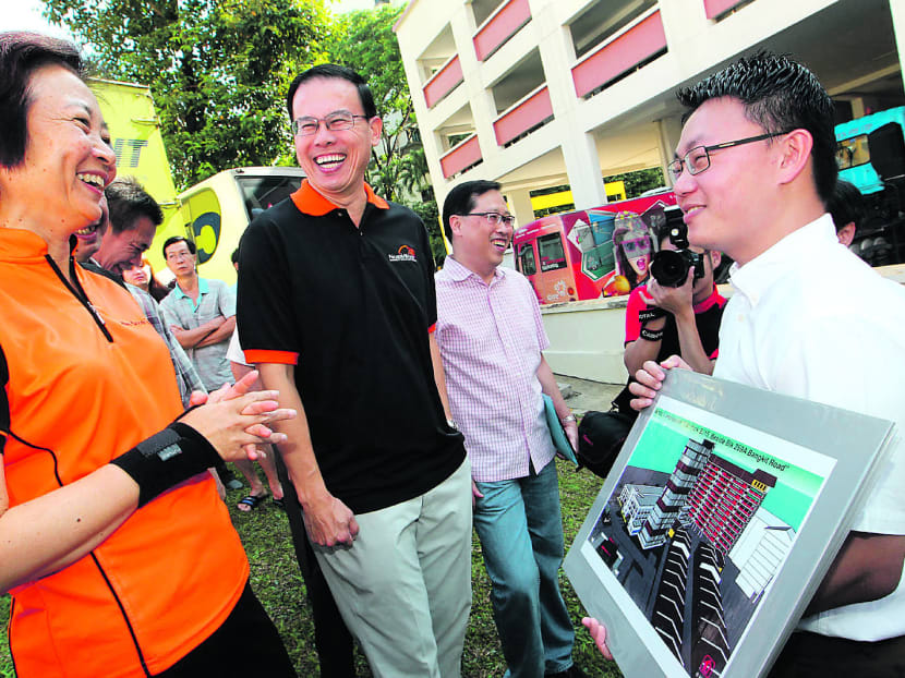 Dr Lee Bee Wah (left) and Dr Teo Ho Pin being briefed on the mechanised parking system while on a site visit in Bukit Panjang on Oct 6. Photo: Ooi Boon Keong