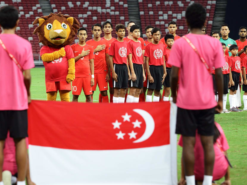 The Singapore team sing the national anthem during the 2019 Asian Cup Qualifier match between Singapore and Bahrain at National Stadium on November 14, 2017 in Singapore. Photo: Getty Images
