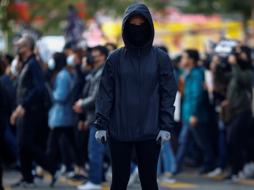 Hong Kong anti-government protester Fiona, 16, during a march organised by the Civil Human Rights Front in the protest-racked city on Dec 8.