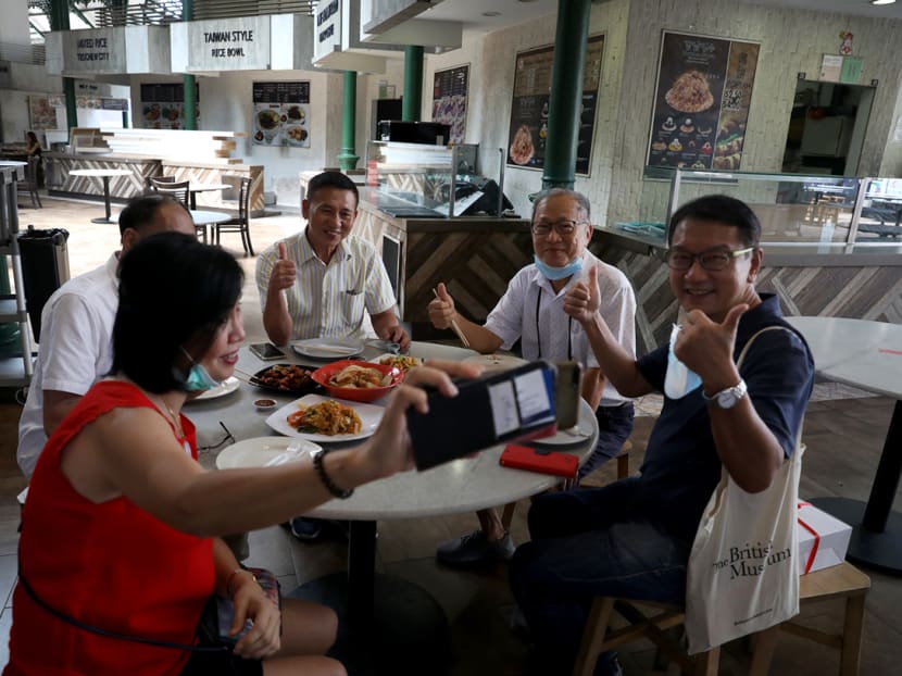 A group of friends take a selfie before having lunch at Lau Pa Sat hawker centre on Friday (June 19).