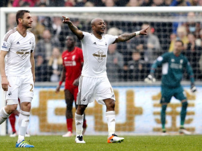Andre Ayew (right) scored two goals for Swansea City, securing them a win against Liverpool. Photo: Action Images via Reuters