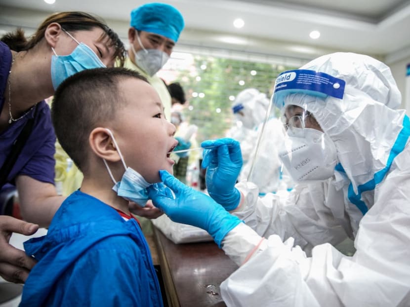 This photo taken on Aug 8, 2021 shows a child being given a nucleic acid test for the Covid-19 coronavirus in Nantong, in China's eastern Jiangsu province.