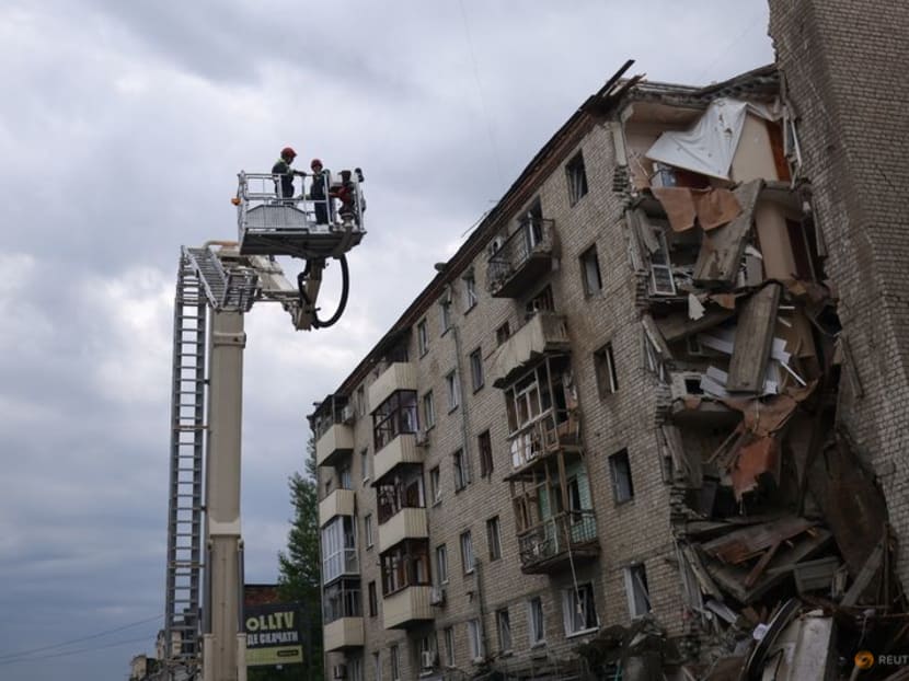 Firefighters work on removing debris after a military strike hit a building, as Russia's invasion of Ukraine continues, in Kharkiv, Ukraine July 11, 2022. REUTERS/Nacho Doce Firefighters work on removing debris after a military strike hit a building, as Russia's invasion of Ukraine continues, in Kharkiv, Ukraine July 11, 2022. REUTERS/Nacho Doce