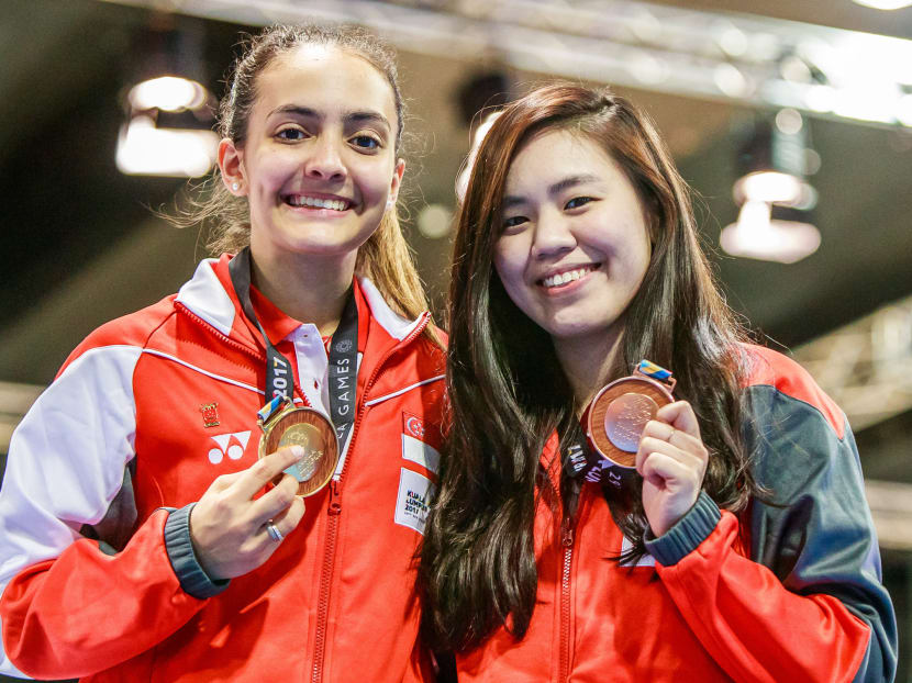 Amita Berthier (left), seen here with teammate Nicole Wong at the SEA Games, is now ranked 13th on the world junior ladder. Photo: Stanley Cheah/Sport Singapore