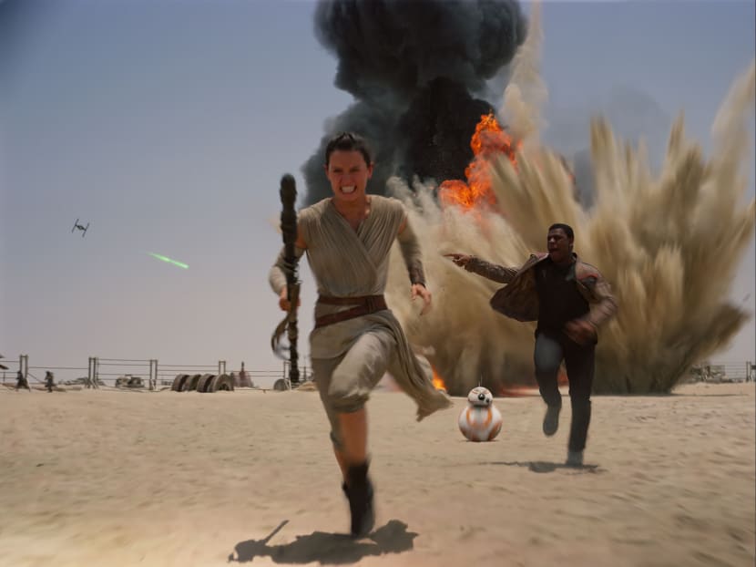 This photo provided by Disney shows Daisey Ridley as Rey, left, and John Boyega as Finn, in a scene from the new film, "Star Wars: Episode VII - The Force Awakens," directed by J.J. Abrams. The movie releases in the U.S. on Dec. 18, 2015. Photo: AP