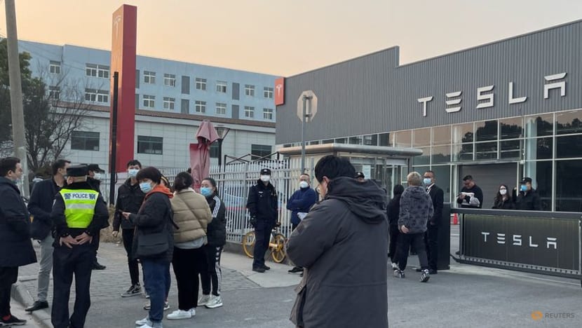 Tesla owners in China protest against surprise price cuts they missed - CNA