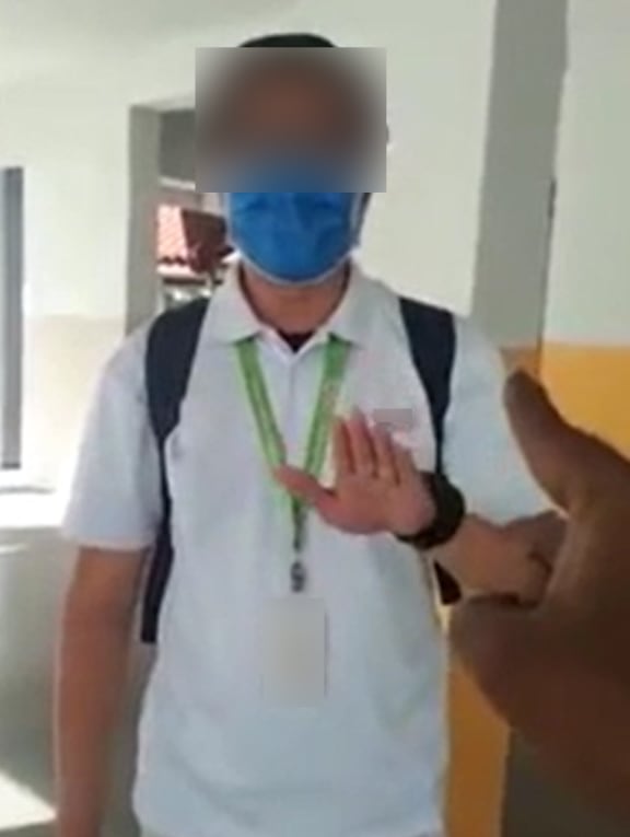 In a video that was posted on Reddit on Friday, a man is heard berating two NEA enforcement officers who had caught him smoking at the void deck.