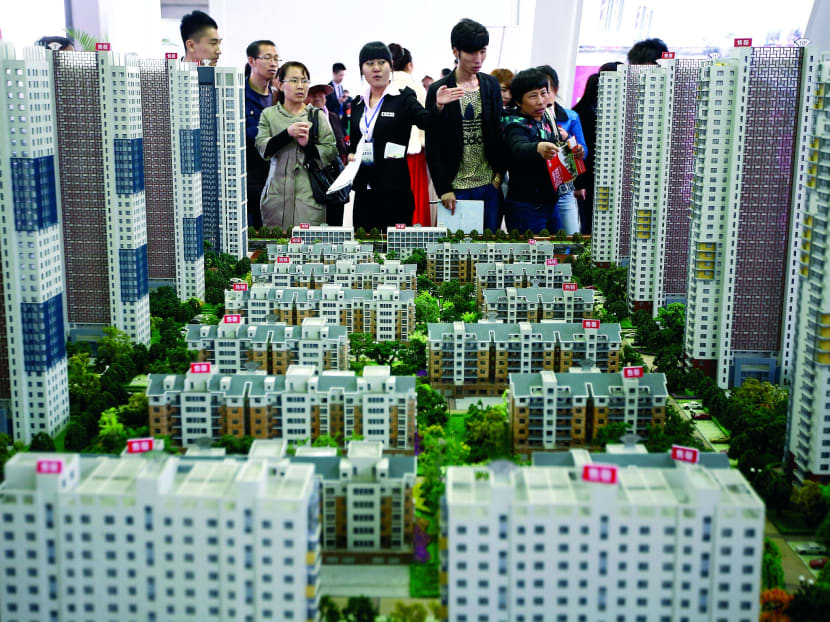 Real estate and related industries account for about a fifth of China’s total economic output. A rapid cooling of home prices will slow growth and in turn hurt its trading partners. 
Photo: Reuters
