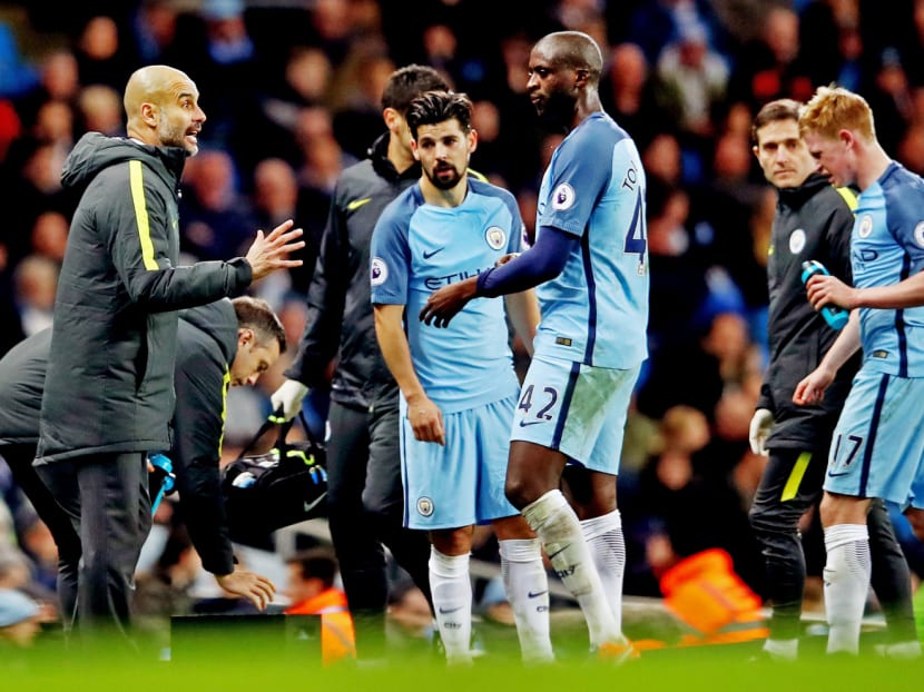 Guardiola’s (left) rapid ice-hockey style of football often looks alien to City, who are accustomed to crushing opponents in a slower, more traditional manner. Photo: Getty Images