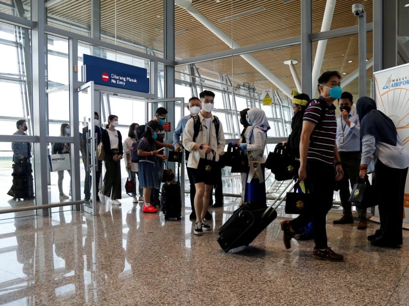 Travellers arriving at Kuala Lumpur International Airport.