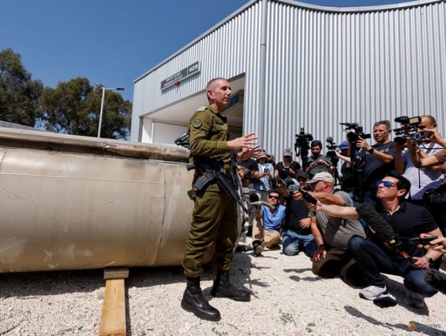 Israeli military spokesperson Rear Admiral Daniel Hagari speaks to the media as Israel's military displays what they say is an Iranian ballistic missile which they retrieved from the Dead Sea after Iran launched drones and missiles towards Israel, at Julis military base, in southern Israel on April 16, 2024. 