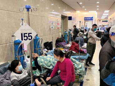 Patients lie on beds in a hallway in the emergency department of Zhongshan Hospital, amid the coronavirus disease (Covid-19) outbreak in Shanghai, China Jan 3, 2023. 