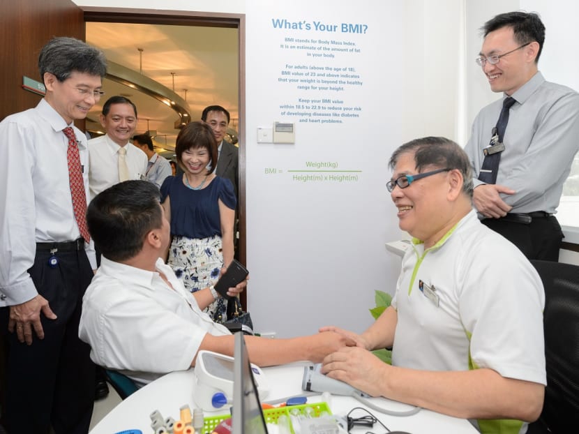 Free health screenings are made available to SMRT's taxi drivers through the pilot preventive health screening and coaching programme. Photo: Health Promotion Board