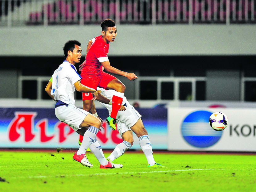 Sahil Suhaimi fires Singapore ahead against Laos in their opening Group A match of the SEA Games at the Zeyar Thiri Stadium in Naypyidaw yesterday. Photo: Singapore Sports Council